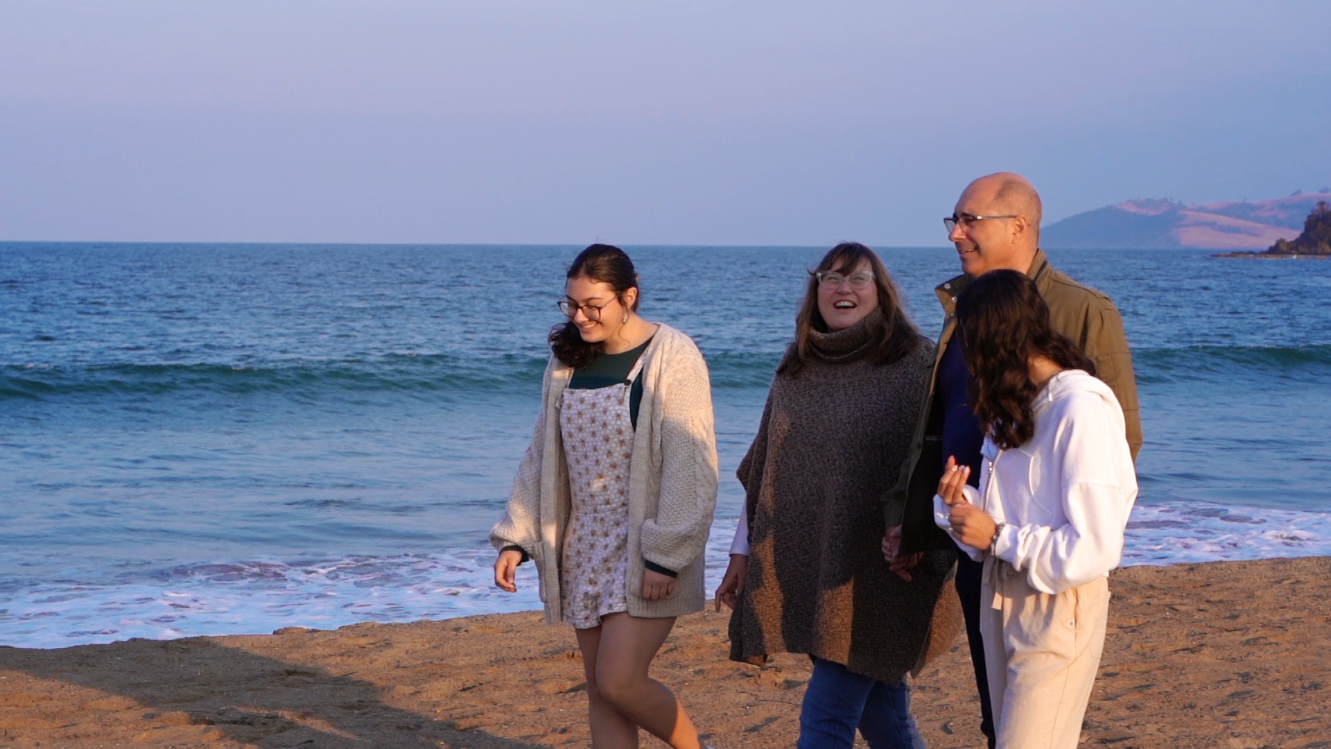 Aldo and family walking on the beach