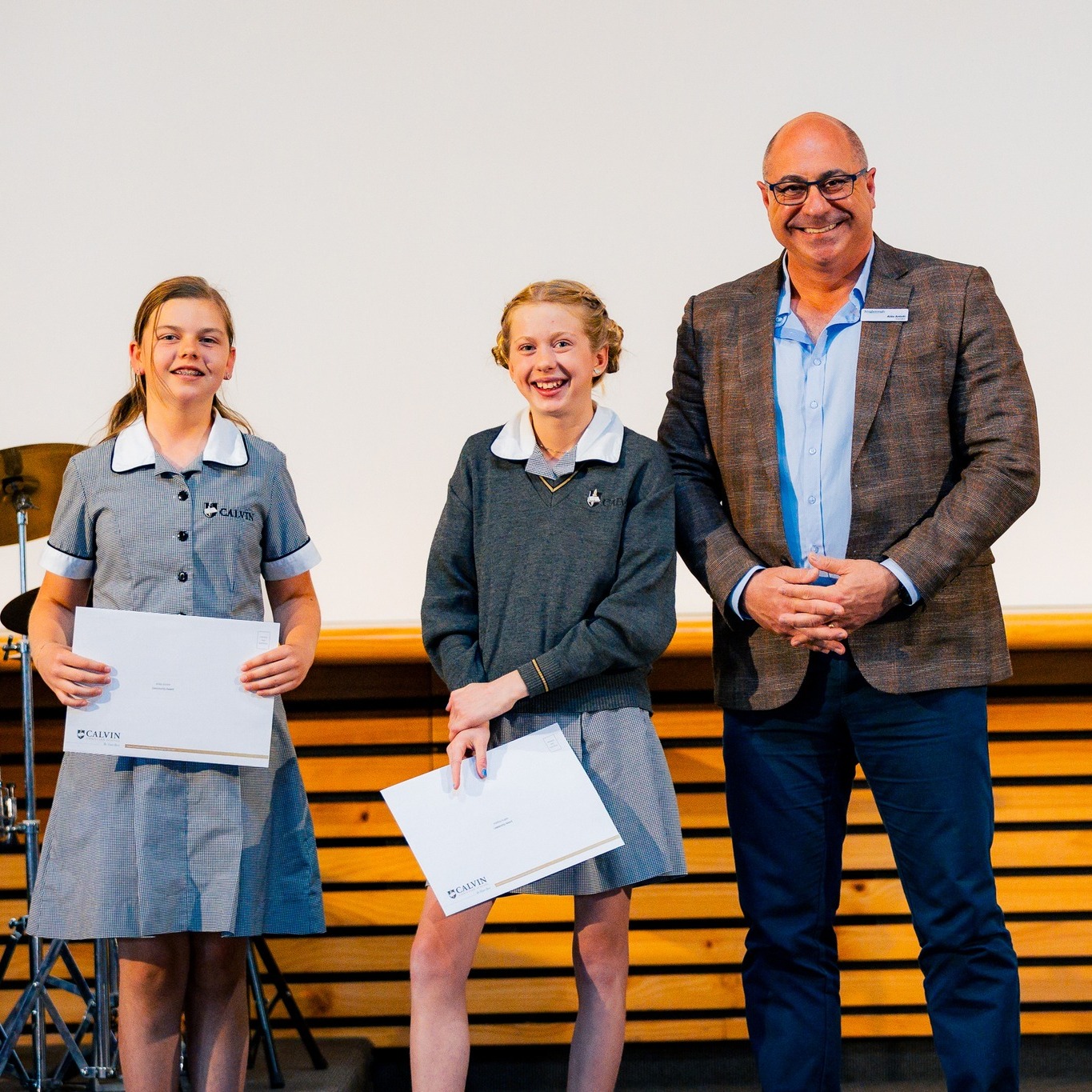 Aldo presenting awards to students at Calvin College